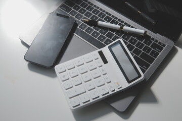 Office leather desk table with calculator and pen. Top view with copy space