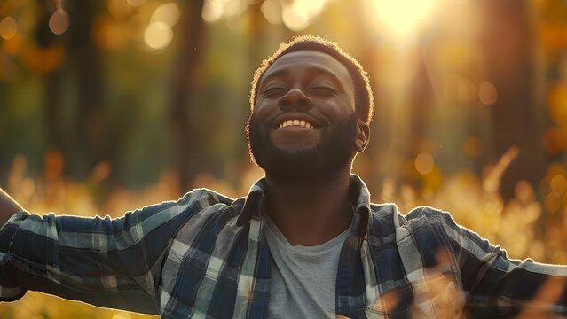 Man in prayer with arms raised to God in trial and hope. Concept Faith, Prayer, Hope, Trials, God