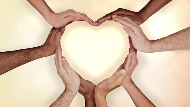 Love concept with Multi Ethnic Hands Forming a Heart. Perfect Background for Valentines Day. Female and Male Hands Forming a Heart. 