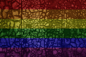 rainbow gay pride flag on a grunge vintage metal rusty cracked wall background
