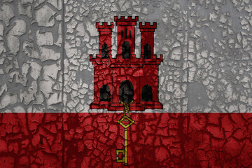 flag of gibraltar on a grunge vintage metal rusty cracked wall background