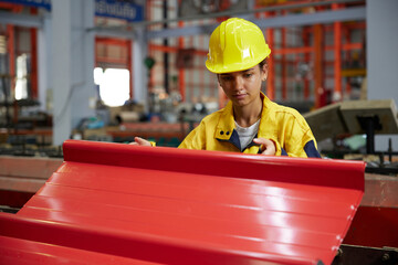 worker or technician holding and checking quality metal sheet in the factory