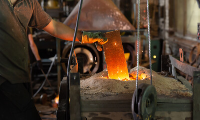 Ferrous metal billet is melted in an induction furnace closeup