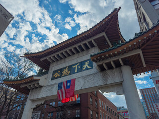 Chinatown Gateway Paifang with US national flag and Republic of China (Taiwan) flag hanging on, in...