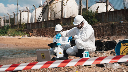 Scientists in protective suits conduct chemical and water quality analyses to monitor the factory's...