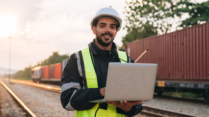 Supervisor inspecting inventory or task information on freight train cars and shipping containers....