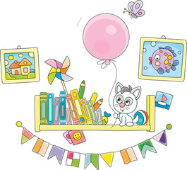Funny little kitten sitting on a decorated bookshelf with children’s books and playing with a big pink balloon and merry butterfly flying around, vector cartoon illustration on a white background