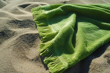 Flat lay of fabric towel on beach sand