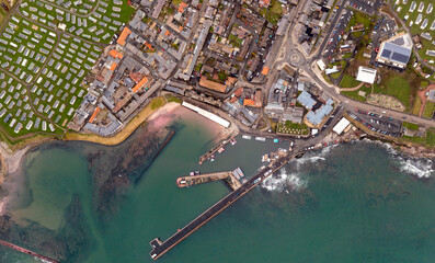 Aerial top down view of Seahouses harbour and town in Northumberland