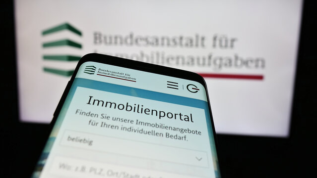 Stuttgart, Germany - 04-15-2024: Smartphone with website of German agency Bundesanstalt f&uuml;r Immobilienaufgaben (BImA) in front of logo. Focus on top-left of phone display.