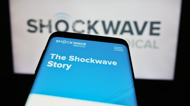 Stuttgart, Germany - 04-15-2024: Mobile phone with website of US cardiovascular disease company Shockwave Medical Inc. in front of logo. Focus on top-left of phone display.