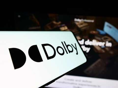 Stuttgart, Germany - 04-17-2024: Cellphone with logo of audio technology company Dolby Laboratories Inc. in front of business website. Focus on center-left of phone display.