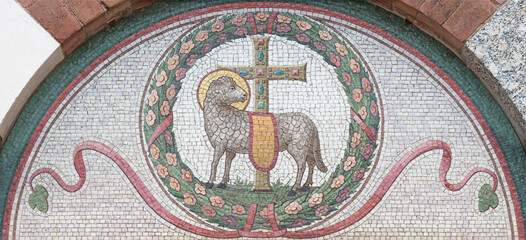 MILAN, ITALY - MARCH 6, 2024: The mosaic of Lamb of God on the facade of church Basilica di San Babila by unknown artist.
