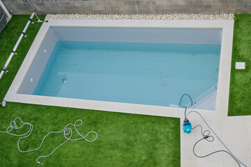pool cleaning of the dirty water after winter season