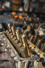 Close up of a car engine. Cylinder heads. Valves. Valve springs. Sixteen valves. Auto service. Car repairing.