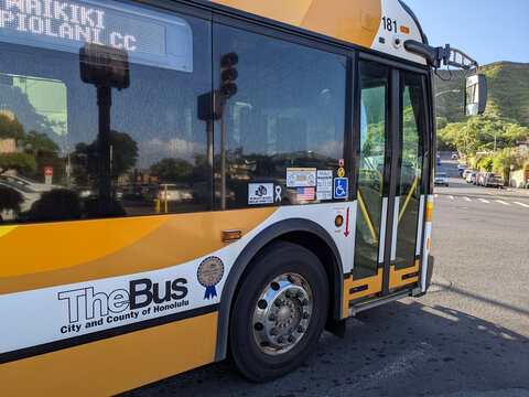 Bright Yellow City Bus From TheBus Honolulu Fleet on a Sunny Day