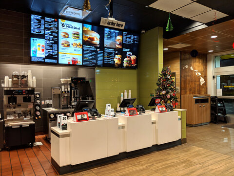 Modern Fast Food Restaurant Interior During Evening With Digital Menu Displays