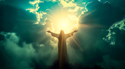 Silhouette of Jesus with arms raised up towards the sky in sign of redemption and spirituality.