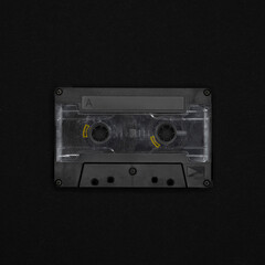 Vintage blank cassette tape on a black background