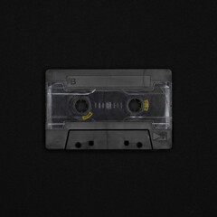 Obraz premium Vintage blank cassette tape on a black background
