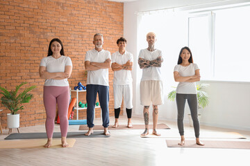 Group of sporty people training in gym