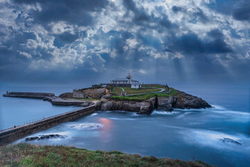 Coastal Lighthouse Amidst Stormy Skies