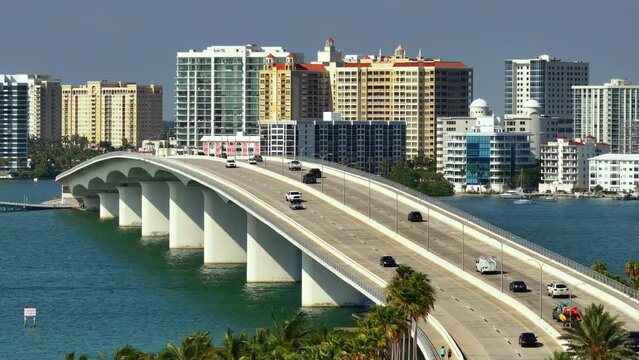 USA travel destination. Aerial view of Sarasota city downtown with Ringling Bridge and high-rise office buildings on horizon. Real estate development in Florida