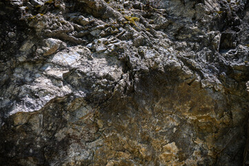 Close-up. Dark gray stone basalt background for design. Banner.