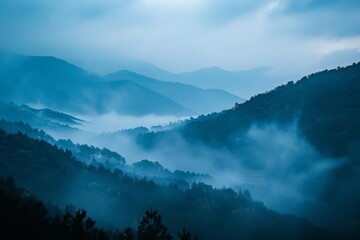 Naklejka premium A beautiful landscape of misty mountains in the morning