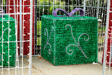 A green box with a purple bow on it