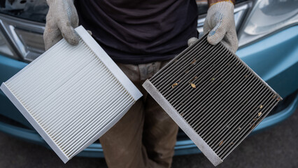 The master changes the cabin air filter of the car.