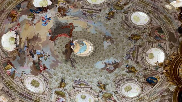 Vicoforte, Mondovi, Italy - April 25, 2024: Dome of the sanctuary of the Nativity of Our Lady, pan on frescoes of the world's largest elliptical dome