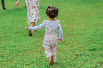 Mother and daughter playing outdoors