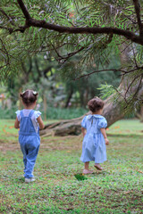 Sibilings playing outdoors