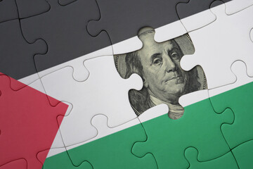 puzzle with the national flag of palestine and usa dollar banknote. finance concept