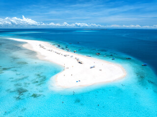 Aerial view of Nakupenda island, sandbank in ocean, white sandy beach, boats, blue sea during low...