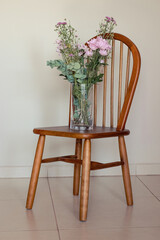 Flower vase on a chair