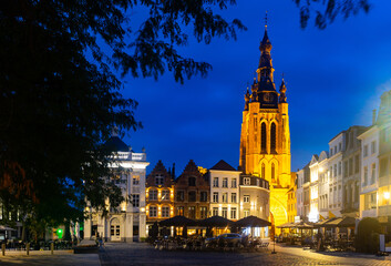 Evening landscape of the central Grote Markt square with a view of St. Martin Church in city of Kortrijk, Belgium