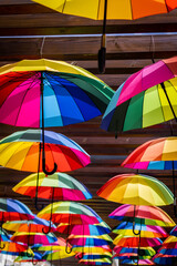 Many colorful umbrellas. Umbrella in the air.