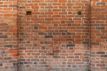 Fototapeta premium wall of a real medieval castle made of red brick
