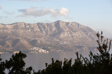 Spring in the mountains, beautiful mountain landscape. View of the mountain range and green trees....