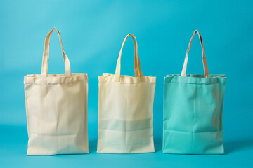 Three Cotton eco bags set, fabric white bag with handle for shopping. Mockup of blank canvas packets, textile reusable ecobags isolated.