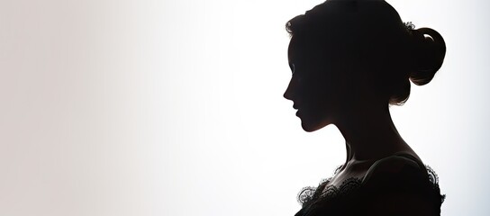 Silhouette of woman with bun hair
