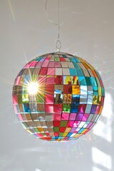 Colorful Disco Ball Radiating Light Rays in Bright Room - Party Atmosphere Concept