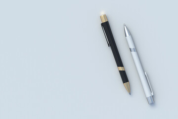 Two pens on gray background. Ink ballpoint. School accessories. Office supplies. Stationery for education. Top view. Copy space. 3d render