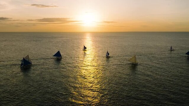 Sunset Sailing in Boracay. Scenic landscape of boats running over the sea. Philippines.