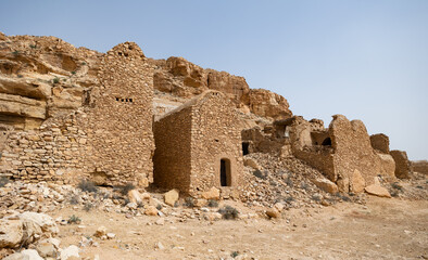 View of ancient abandoned town of Ghomrassen, Berber houses and granaries, Tataouine region of...
