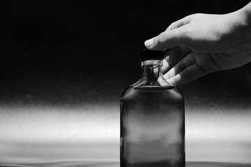 Close up of glass bottle in monochrome