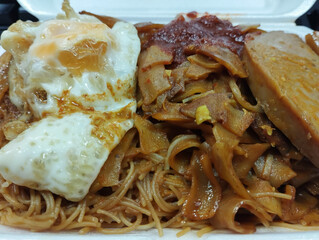 fried thin and thick noodles with egg and chili dish