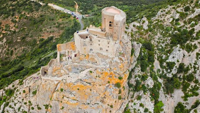 Aerial view of castle ruins perched on a craggy outcrop, with panoramic views from its tower terrace in France.
High fortress on the southern ridge of the Corbi&egrave;res, Ch&acirc;teau de Qu&eacute;ribus.